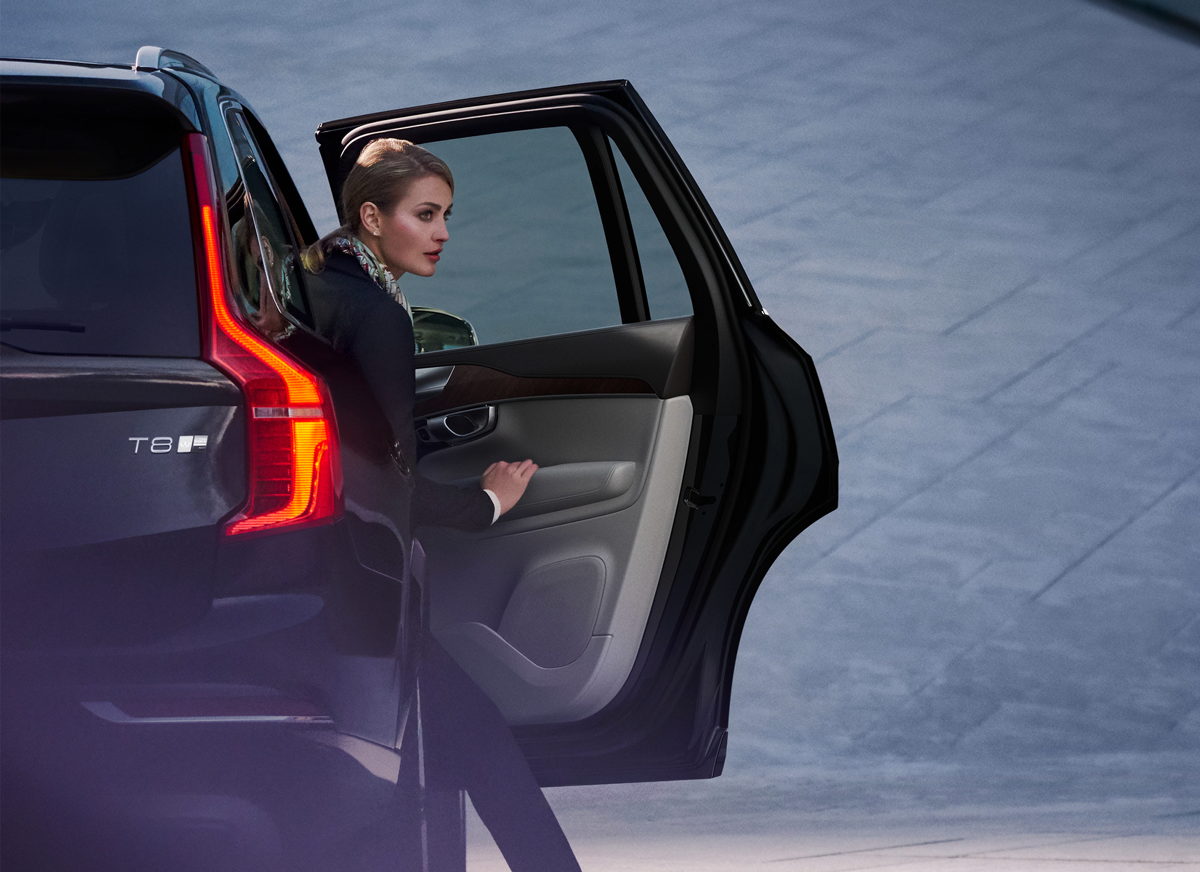 Ready to upgrade your current Volvo? Woman stepping out of the passenger seat
