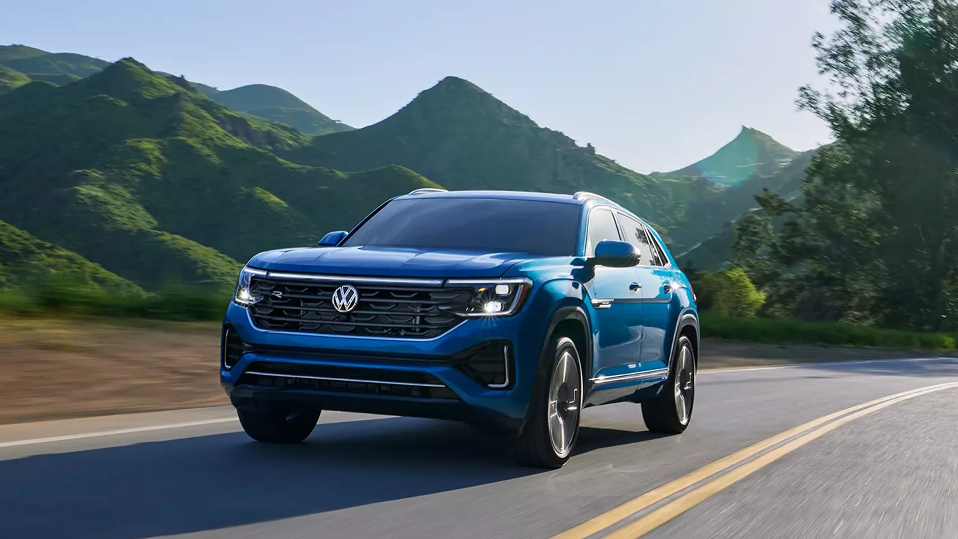 2024 Atlas Cross Sport driving along a mountain road