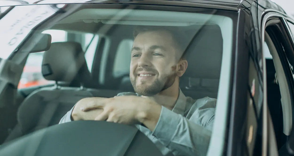 Man sitting in a new Ford