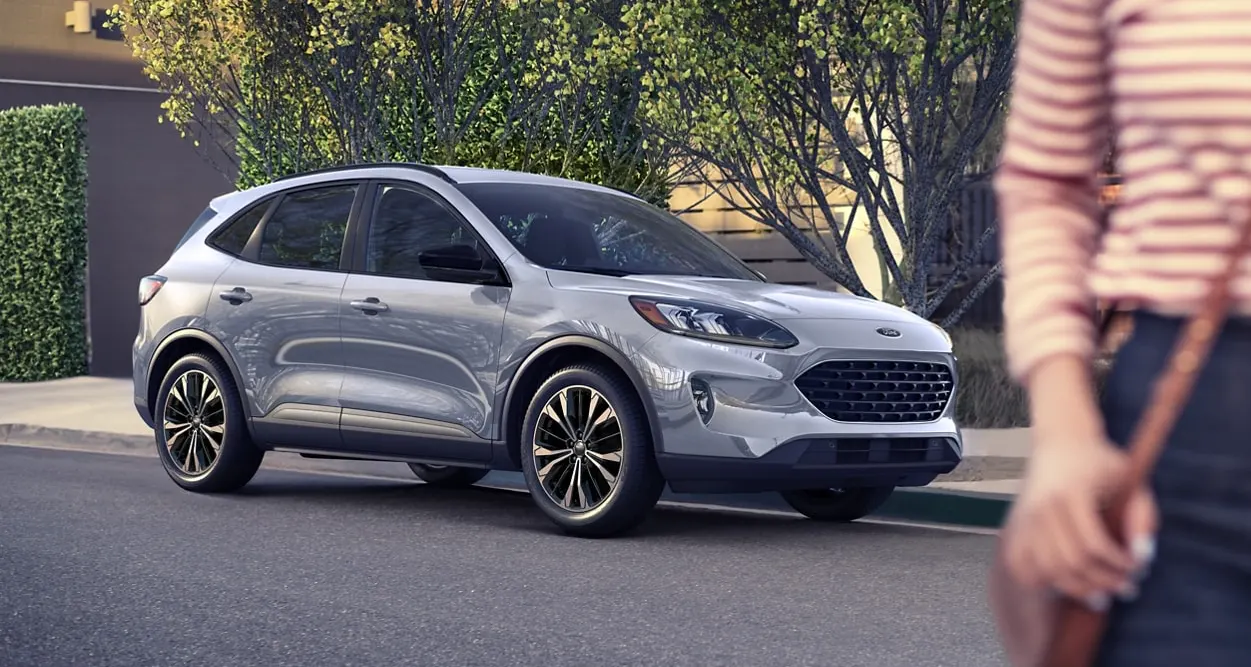 Woman walking away from her new ford.