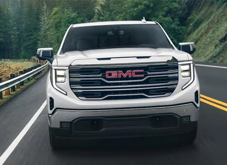 2024 GMC Sierra Driving down a road